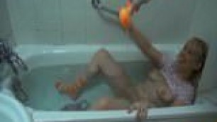 Krakenhot - Funny blonde in the bath playing with the duck